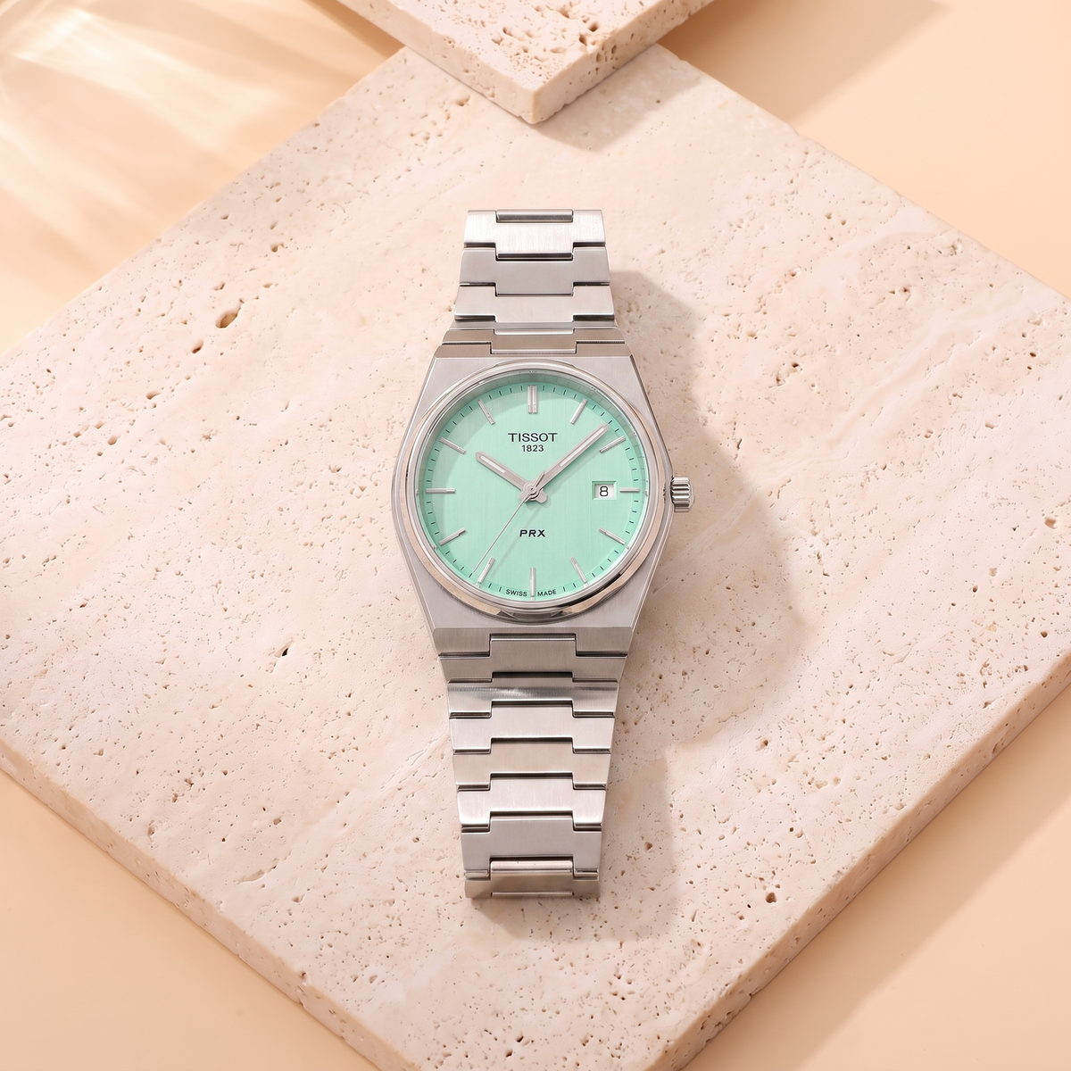 Tissot PRX Tiffany, fond travertin